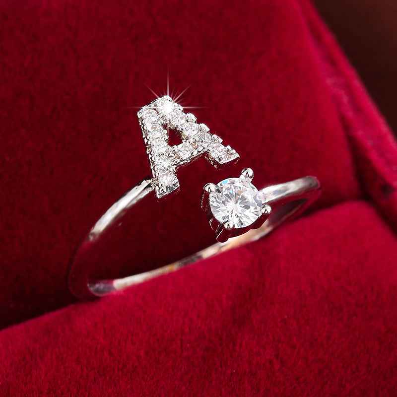 Fashionable 26 English Letters Four-Prong Synthetic Synthetic Zirconia Open Adjustment Ring A Silvery