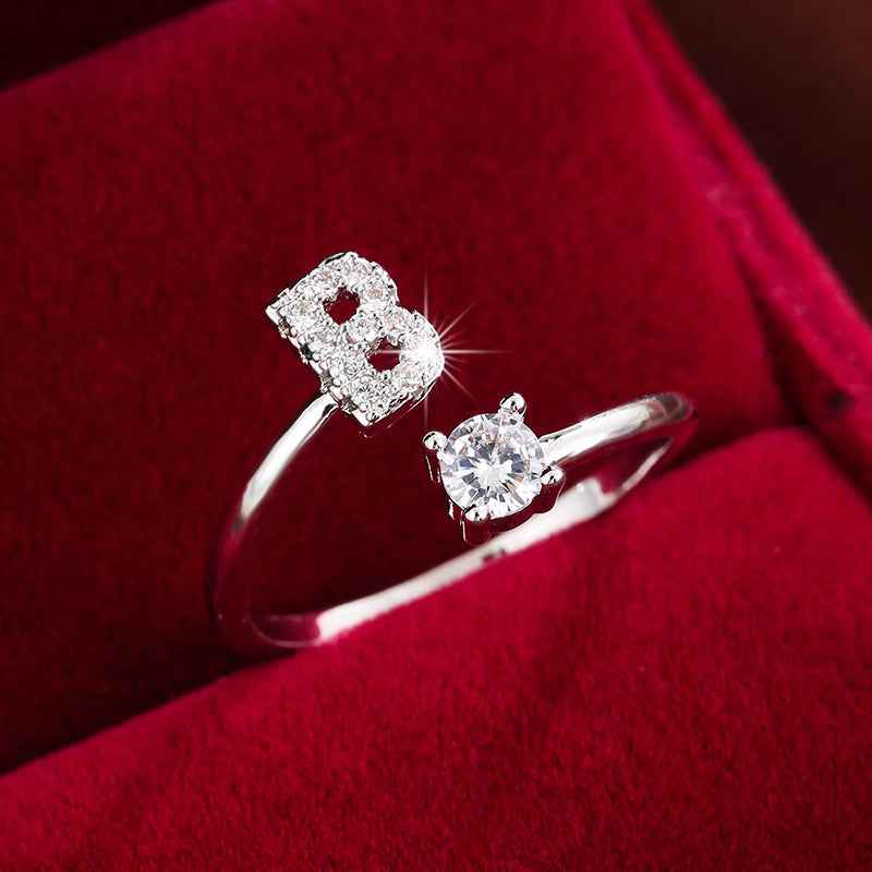 Fashionable 26 English Letters Four-Prong Synthetic Synthetic Zirconia Open Adjustment Ring B Silvery