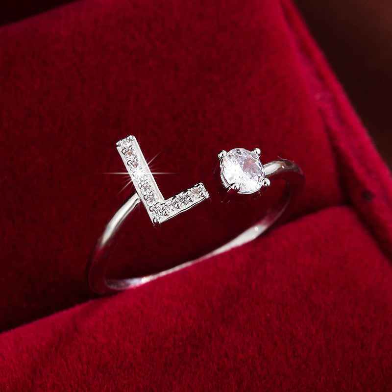 Fashionable 26 English Letters Four-Prong Synthetic Synthetic Zirconia Open Adjustment Ring L Silvery